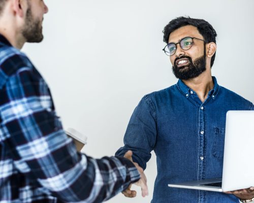 diverse-colleague-men-shaking-hands-together-min-min